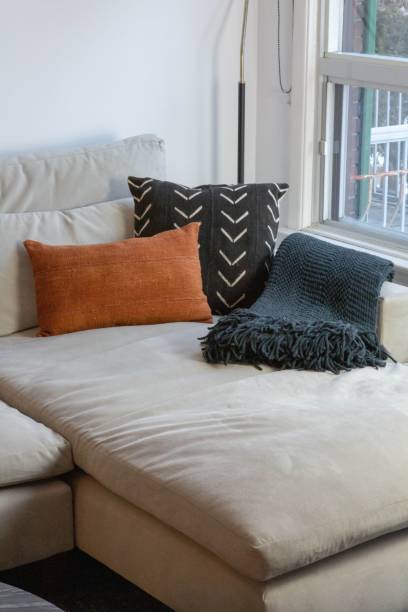 istock Living room with a large white couch with pillows 1530896885