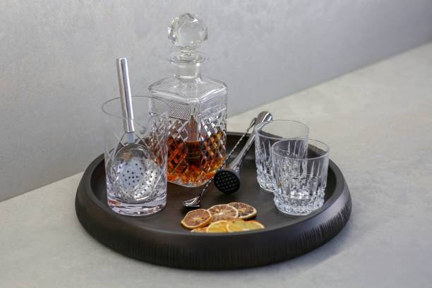 istock Whisky glass decanter with empty glasses and dry lemons 1530896890