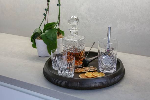 istock Whisky glass decanter with empty glasses and dry lemons 1530896905