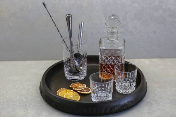 istock Whisky glass decanter with empty glasses and dry lemons 1530896912