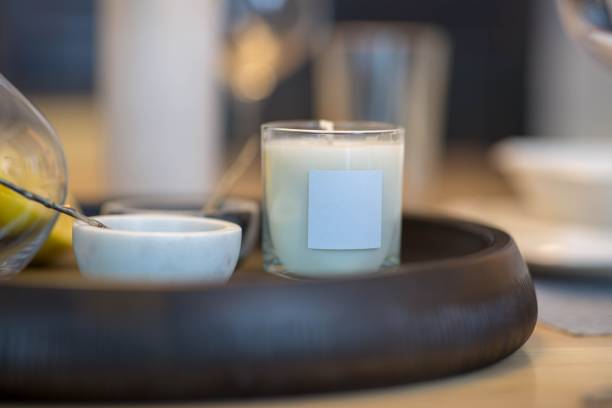 istock White candle sitting on top of a tray 1530897483