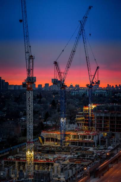 istock Busy construction site with multiple towering skyscrapers in the foreground 1530897501