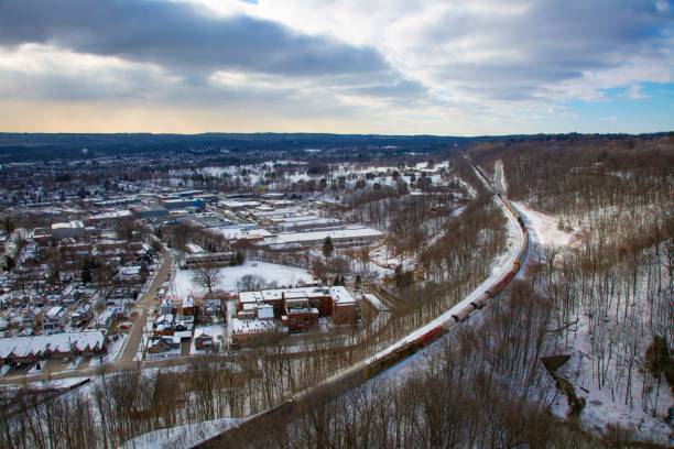 istock Overhead view of a train chugging through a picturesque winter landscape 1530897511