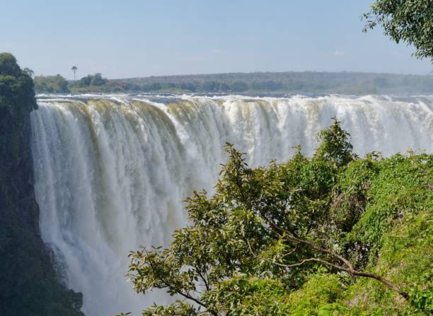 istock there is a water fall over some rocks and trees together 1530900398