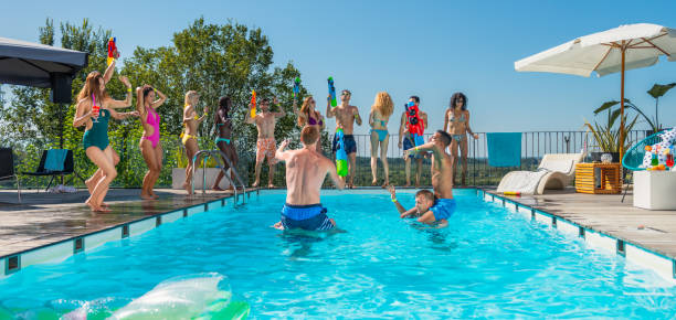 istock Squirt Guns Fights In A Pool 1530902682