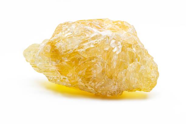 Closeup shot of details on a beautiful natural yellow calcite crystal stone A closeup shot of details on a beautiful natural yellow calcite crystal stone calcite stock pictures, royalty-free photos & images