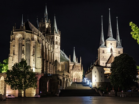 A scenic view of Erfurt Cathedral in Germany illuminated at night