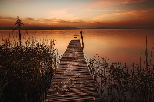 Sunrise over a jetty on the shore of Plauer See in Plau am See in the Mecklenburg Lake District, Germany
