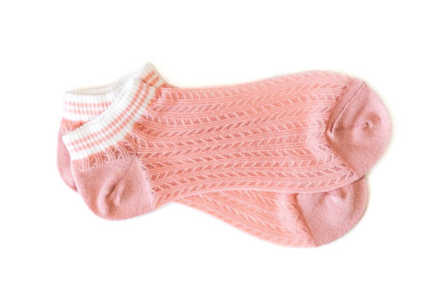 istock Pink pair of women's thin socks on a white isolated background. 1530909141
