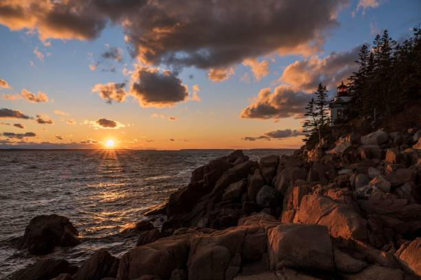 istock Stunning seascape featuring a rocky shoreline with a sunset sky in the background 1530909736