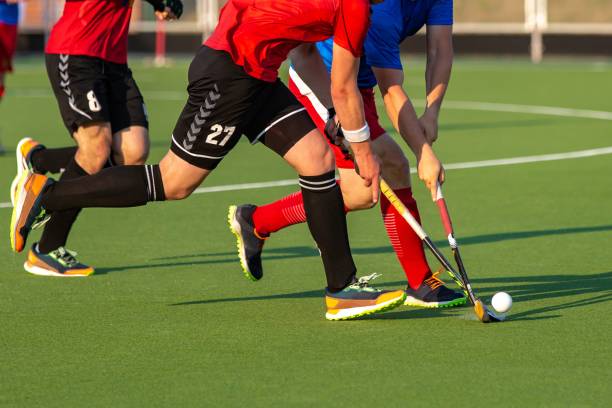 istock Field hockey player on artificial grass play field. 1530910294