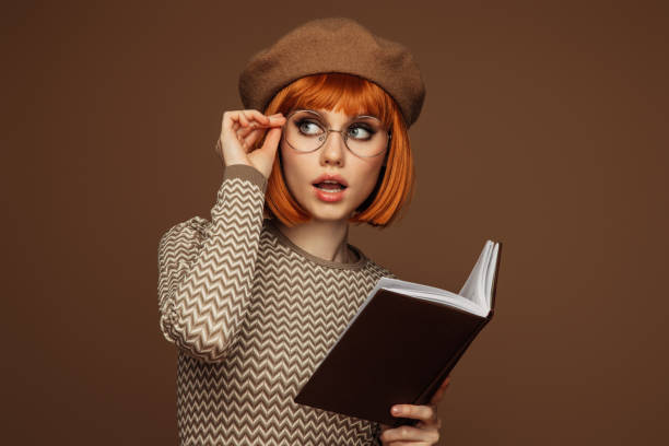 istock Beautiful girl enjoying a book 1530916582