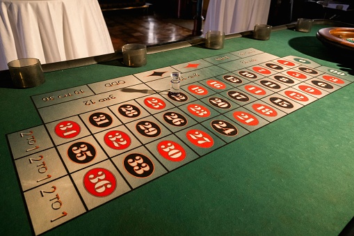 A traditional roulette table with markings for players to place their wagers