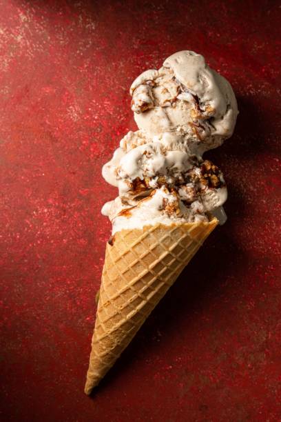 istock Top view of a  chocolate ice cream against a bright red backdrop 1530920730
