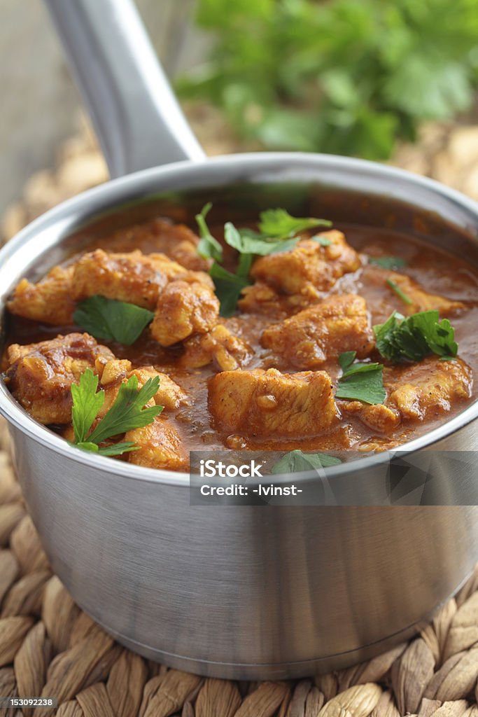 Chicken curry Chicken curry with parsley in a saucepan Indian Food Stock Photo
