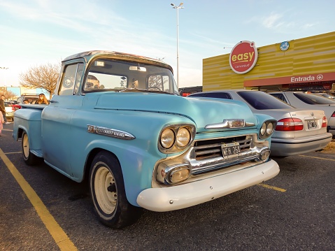 Buenos Aires, Argentina – May 29, 2023: Old light blue utility 1958 Chevrolet Viking 60 pickup truck Task Force flareside bed by GM in a parking lot. Classic car show.