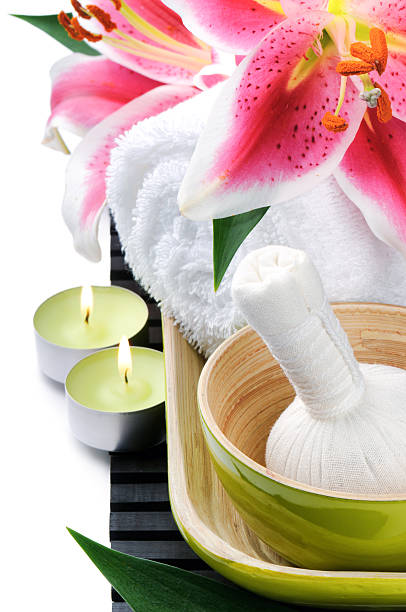istock Spa setting with candles and pink lily 153093170