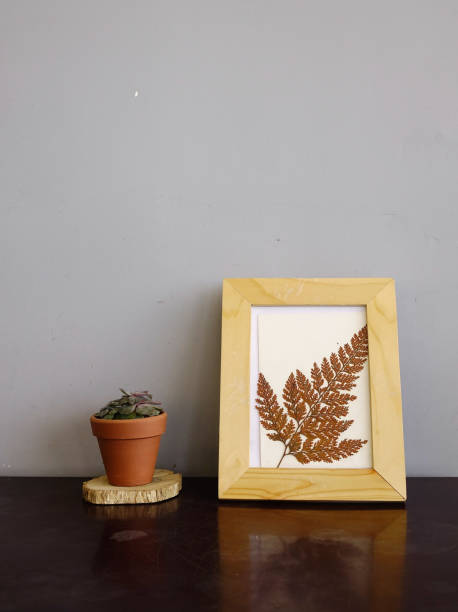 istock Flower vase and wooden picture frame 1530948029