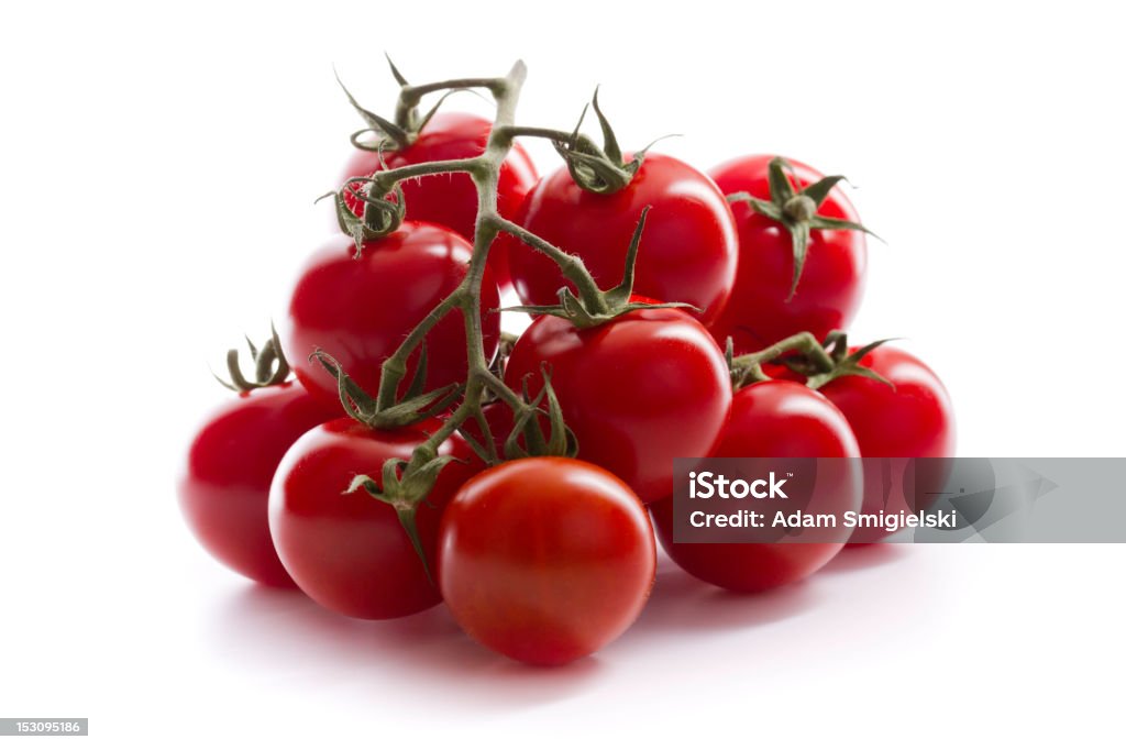 cherry tomatoes twigs twig with cherry tomatoes on white background Cherry Tomato Stock Photo