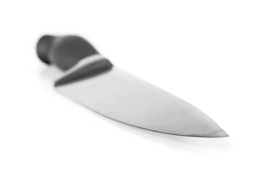 very sharp brand new kitchen knife with large blade on white background