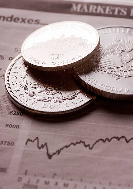 istock dollar coins on financial newspaper 153095342
