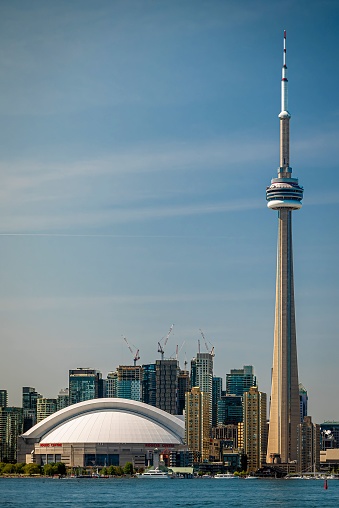 Toronto, Canada – May 26, 2023: A vertical shot of the iconic CN Tower in Toronto, Canada