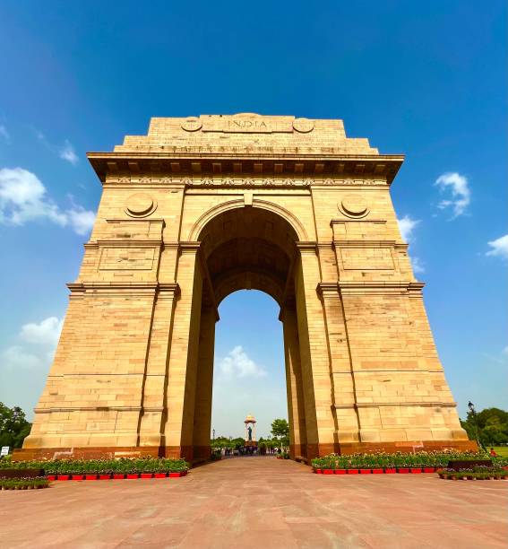 istock Image of India Gate surrounded by lush greenery and a bright blue sky 1530961811