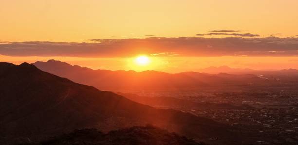 istock Beautiful sun setting at Tempe South Mountain, surrounded by lush greenery 1530961815