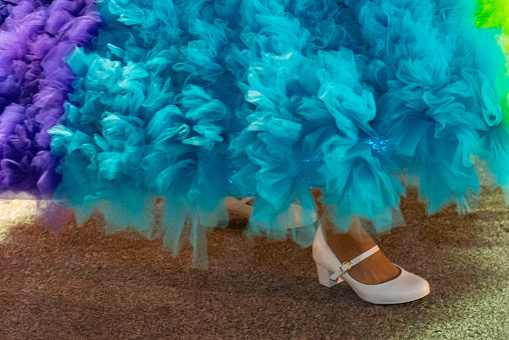 Image of a colorful skirt costume and white shoes