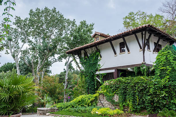 istock House and garden view 153097273
