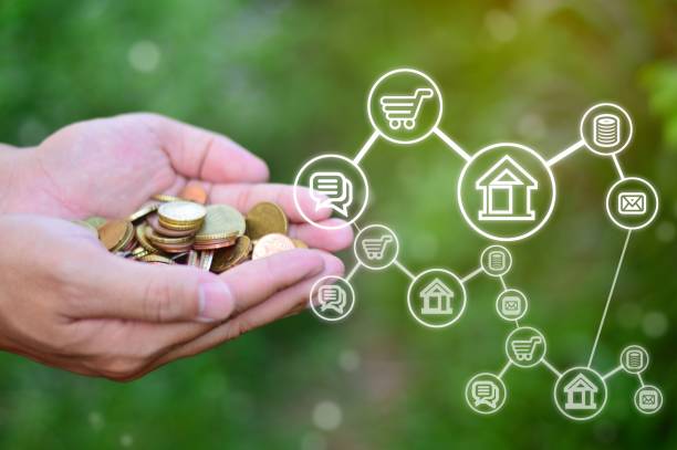 istock Holding virtual trading coins and blurred coins in hand 1530974148
