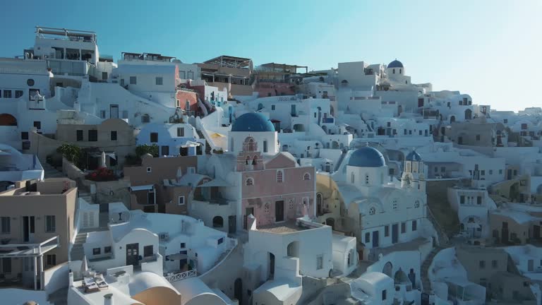 Aerial view of white houses and blue domed churches, Santorini