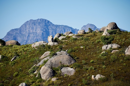 A closeup of Paarl Rocks and Paarl at the mountains of Paarl under the blue sky in South Africa