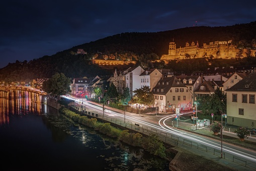 Illuminated Heidelberg Castle at night above Neckar River, Heidelberg, Baden-Wurttemberg, Germany