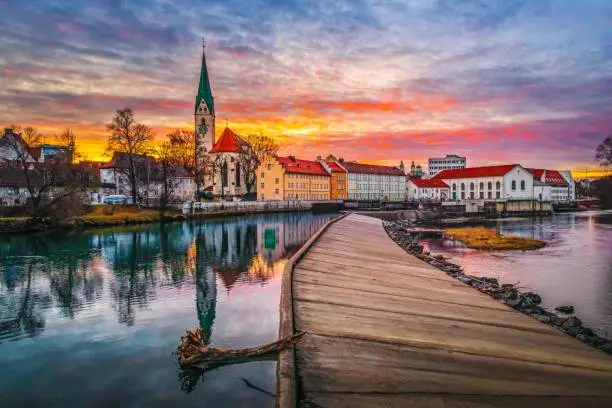 A stunning view of Kempten city in Germany with the River Iller illuminated by the setting sun