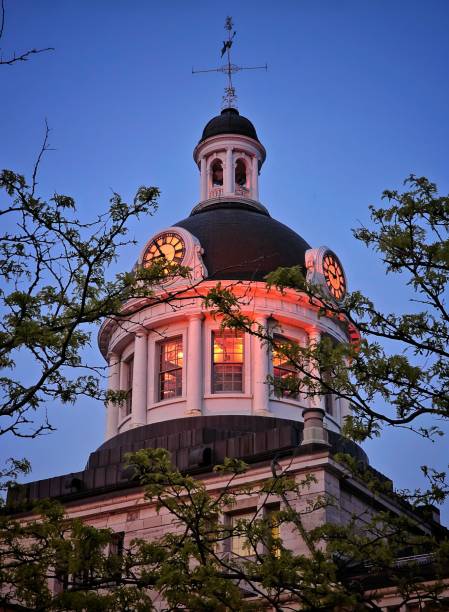 istock High-rise structure with a spire-like feature at its apex, illuminated by red light 1530983917