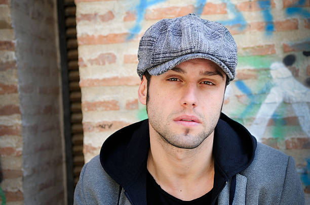 istock Young man in urban background wearing retro cap 153098409