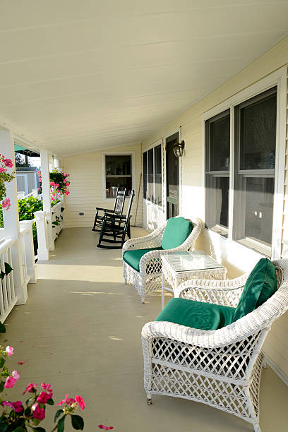 istock quaint covered porch with furniture 153099080