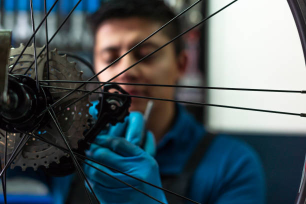 istock Latino man bicycle mechanic is in his highest workshop 1531001625