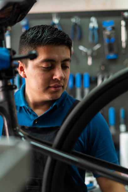 istock Latino man bicycle mechanic is in his highest workshop 1531004487