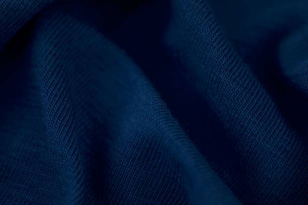 the surface of a blue silk fabric on a white background