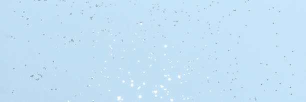 istock Sparkling silver glitter on blue background banner 1531024717