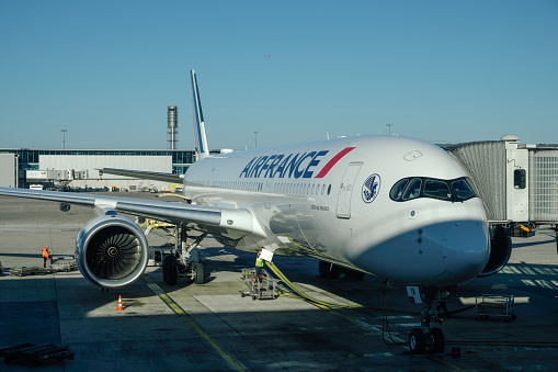 Paris / France - April 24, 2015: Air France Boeing 777-200 F-GSPR passenger plane arrival and landing at Paris Charles de Gaulle Airport
