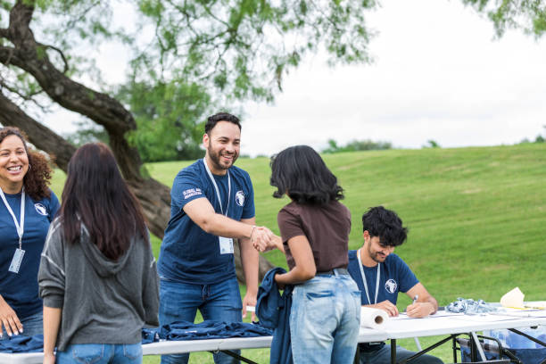 istock Diverse volunteers greet and talk to unrecognizable young women 1531046221