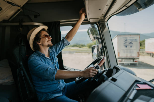 istock Truck driver changing radio station 1531048384