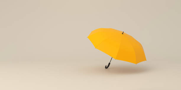 istock Opened yellow umbrella on studio background.Concept of security. 1531050964
