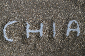 Chia word made from chia seeds as background. SuperFood. Healthy food. Top view.