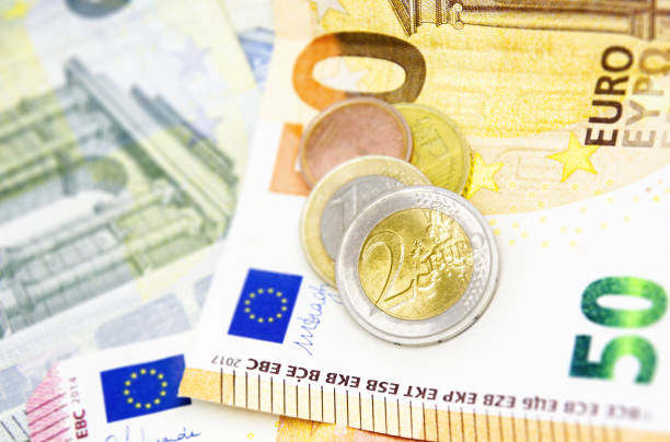 istock Euro coins and banknotes. 1531058315