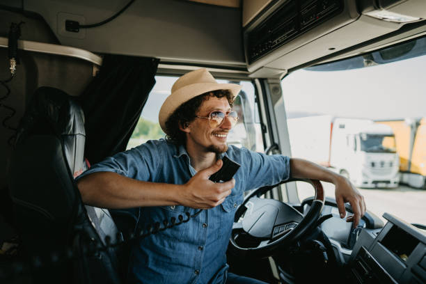 istock Truck driver using his CB radio 1531058927