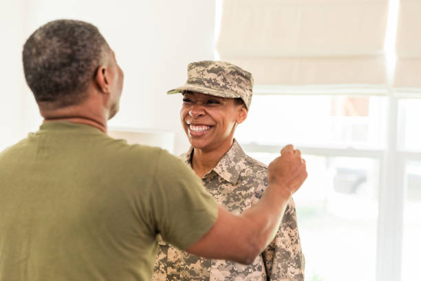 istock Unrecognizable mature dad overjoyed to see soldier daughter 1531059460